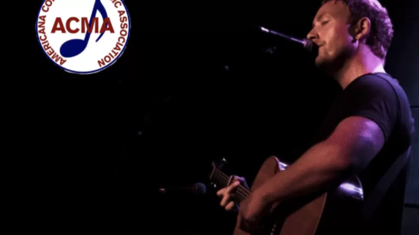 James Kirby playing guitar