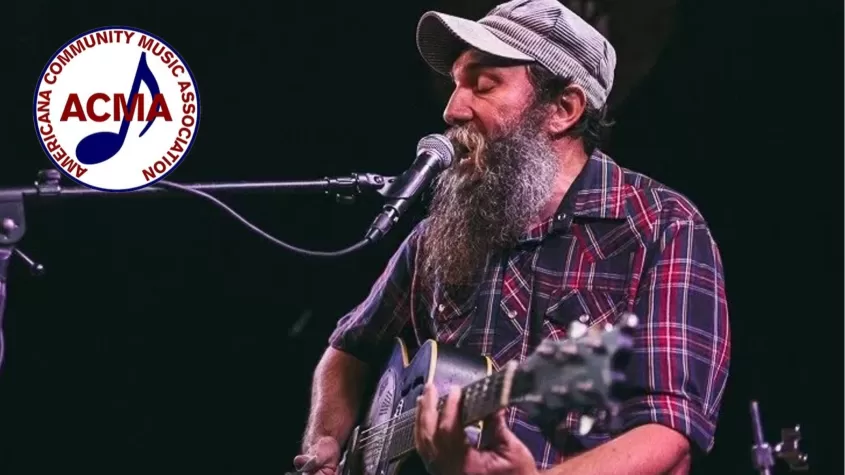 Musician Ben Presage performing with ACMA logo in corner