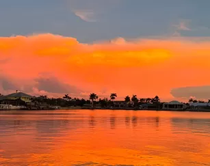 Sunrise light glows over the water in Cape Coral.