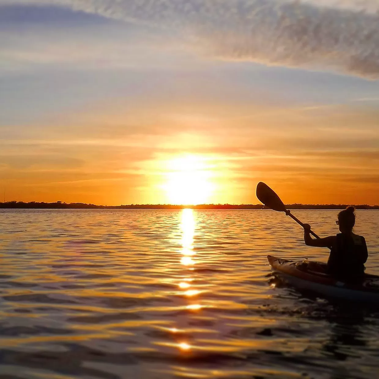 Kayaker silhouette on water in Matalcha